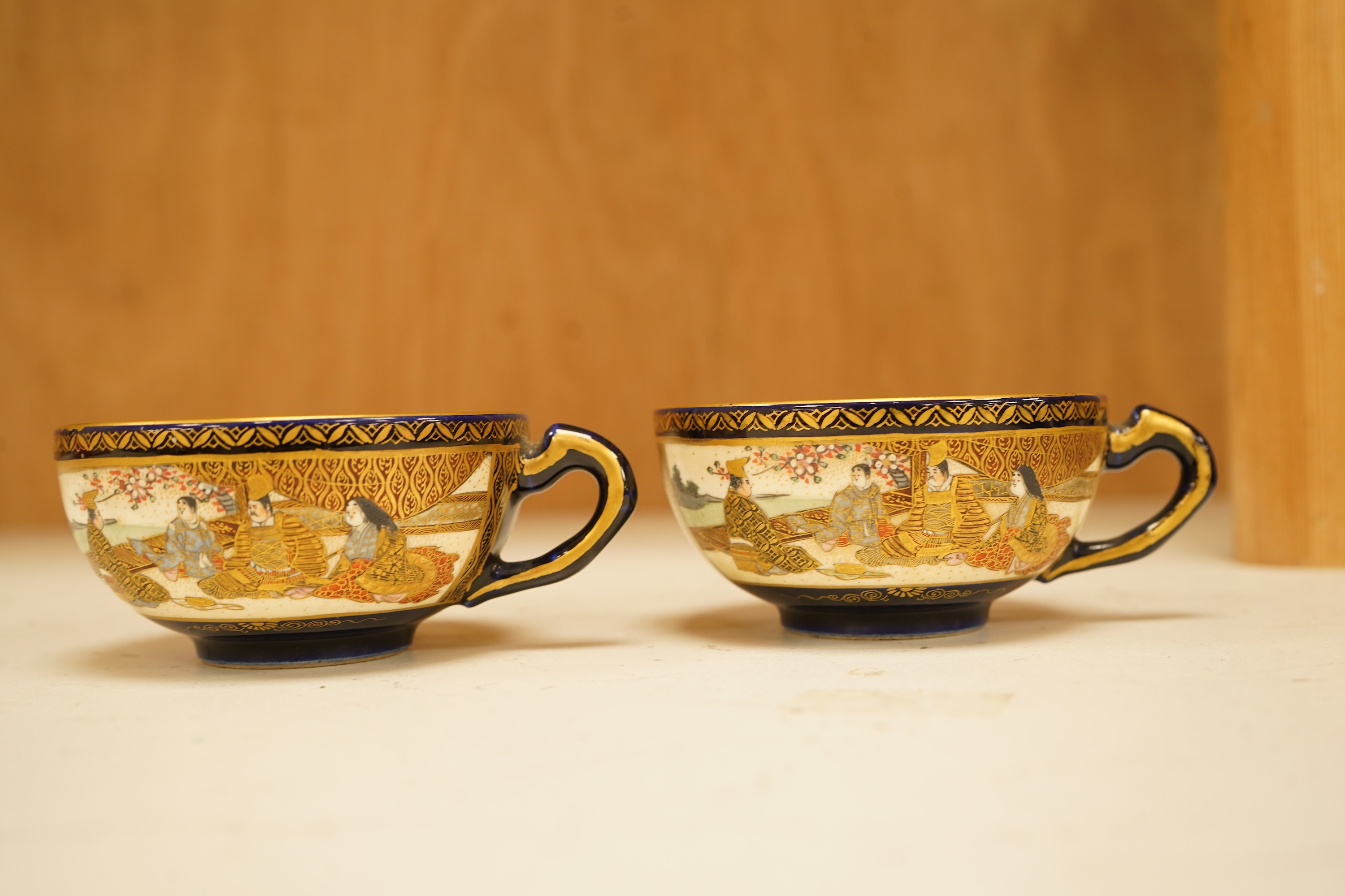 A set of six Japanese Satsuma pottery teacups and saucers, and two further saucers